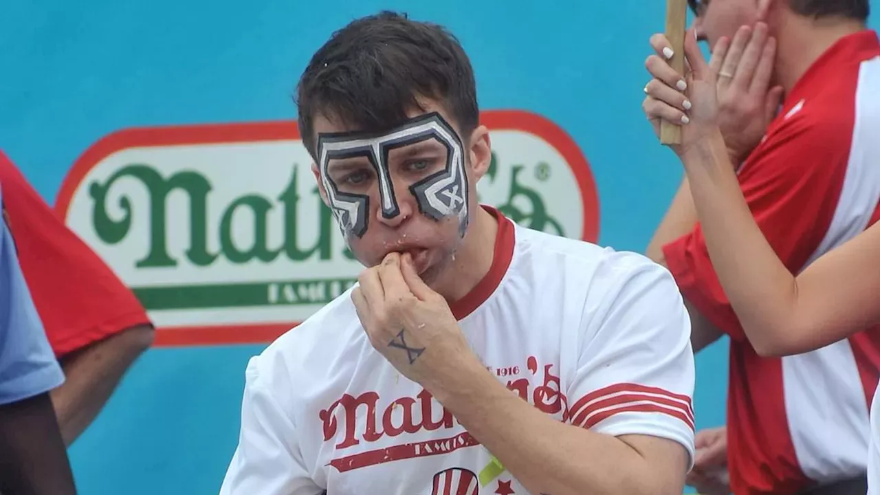 Eater X Tim Janus wearing signature face paint during competitive eating match