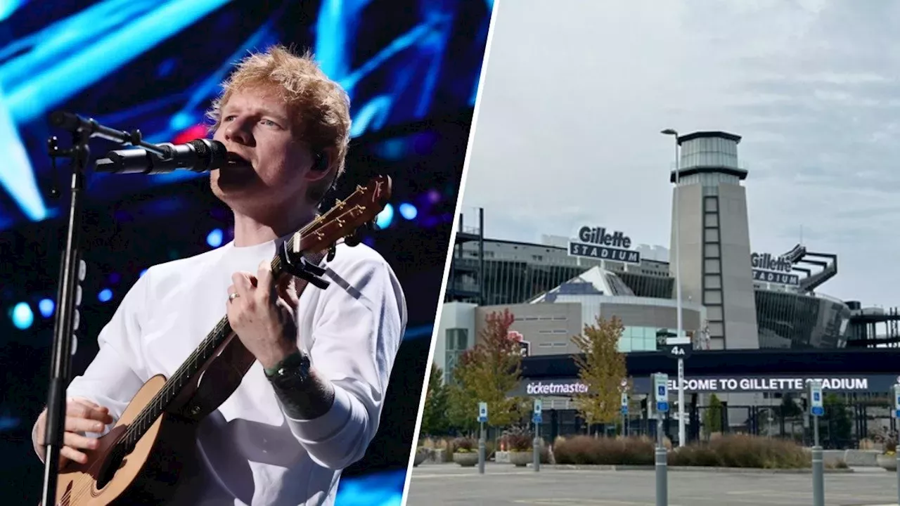 Ed Sheeran performing on stage with bright lights