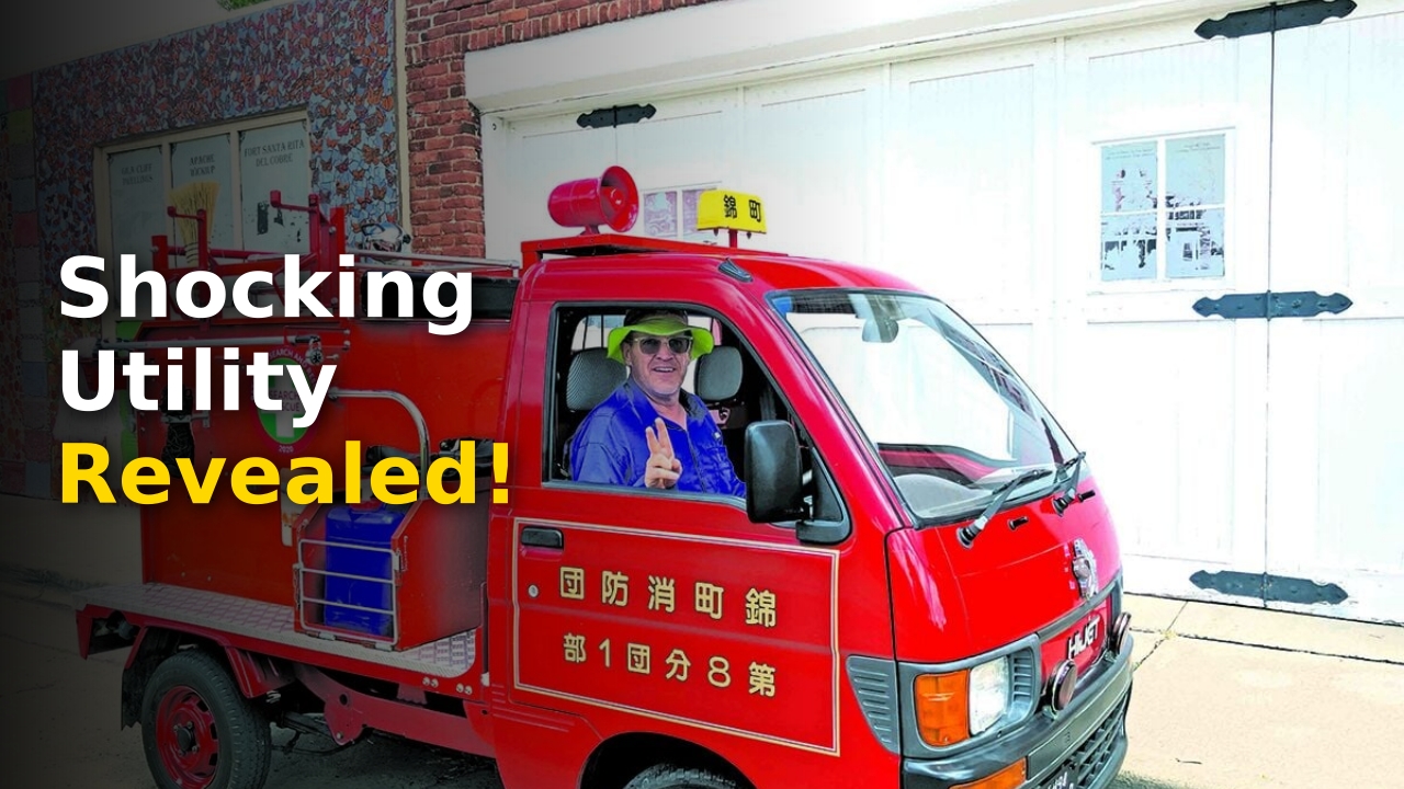 James Holeman standing next to his red Japanese kei truck used as a daily driver