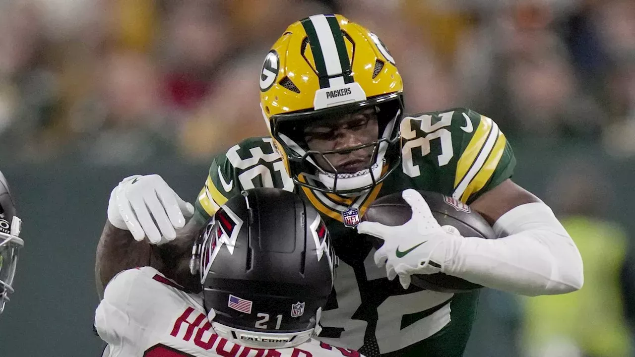 MarShawn Lloyd stopped by defenders showcasing Packers rushing attack collapse