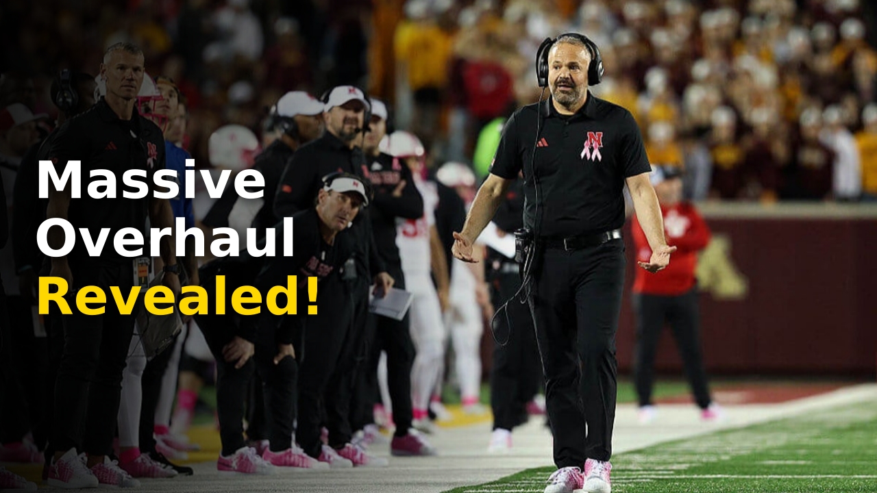 Matt Rhule discussing strategy with his Nebraska coaching staff on the field