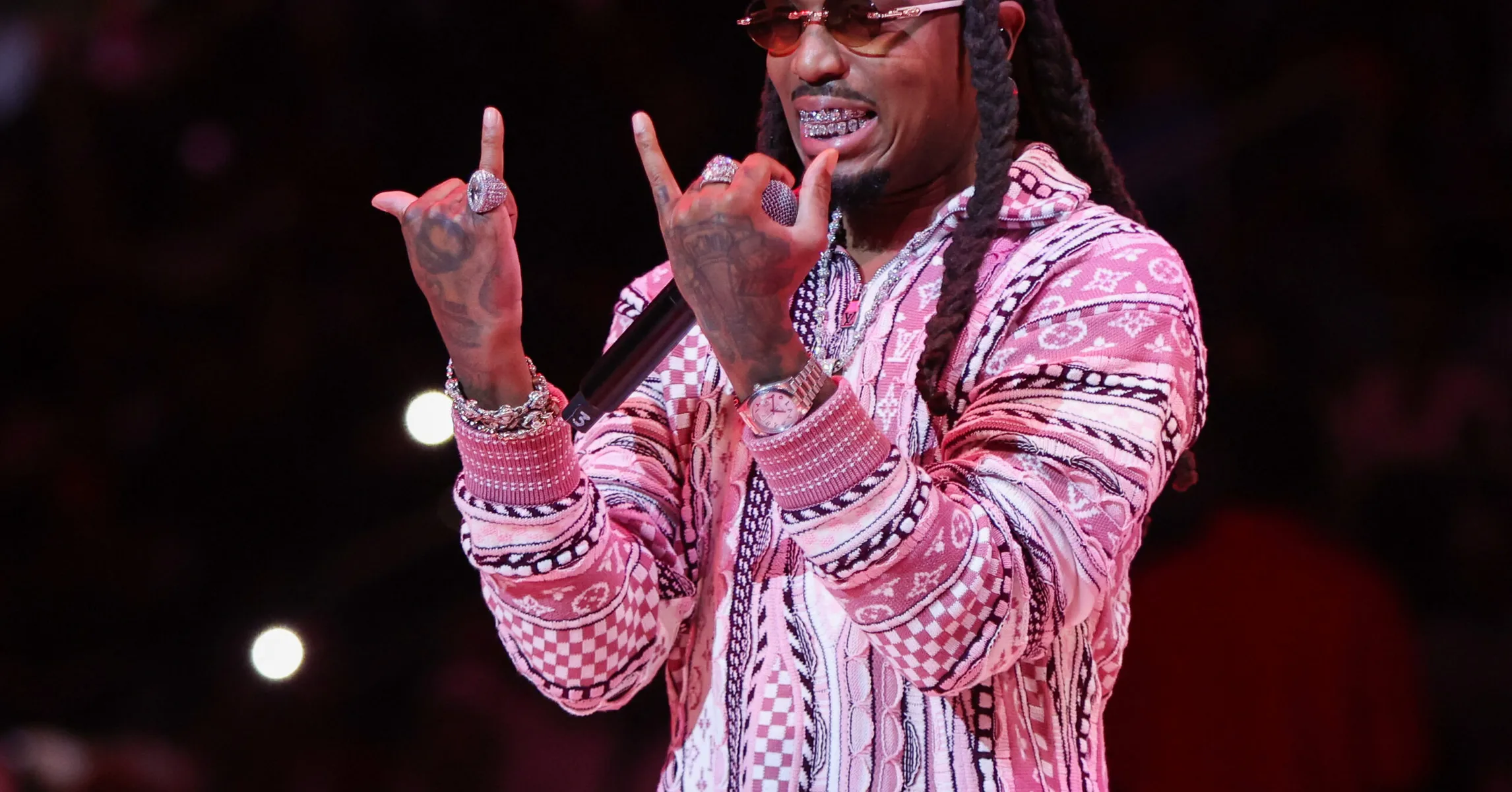 Quavo wearing luxury jewelry and designer fashion illustrating Quavo Net Worth 2026 lifestyle