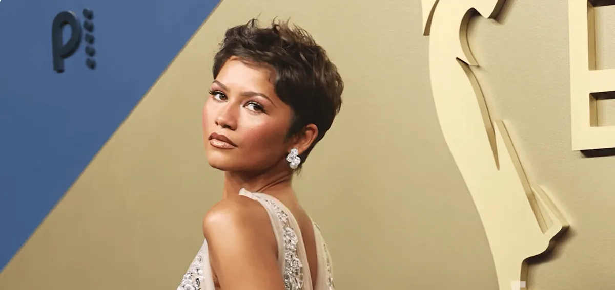 Zendaya wearing a crystal Prada gown with a natural satin skin finish