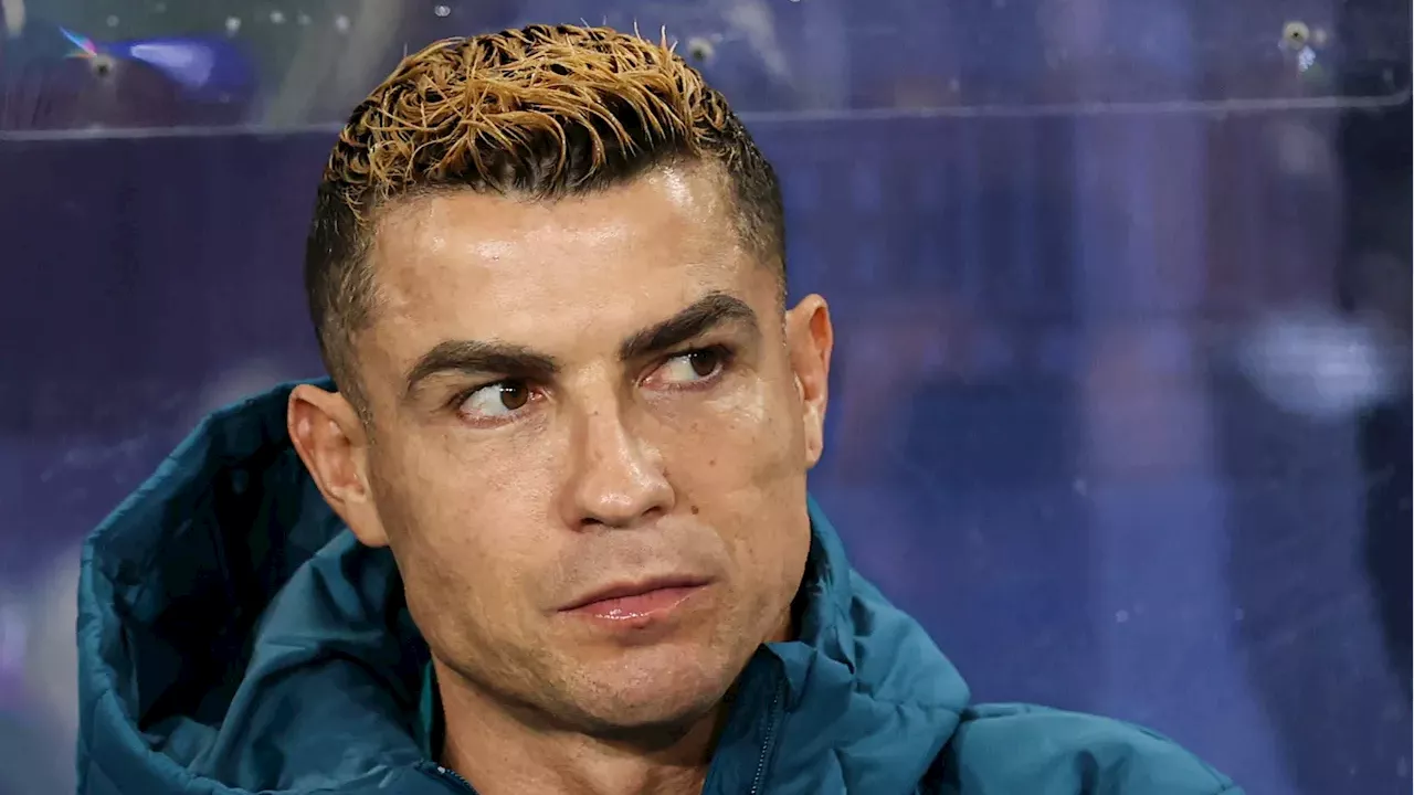 Cristiano Ronaldo wearing national team kit looking distressed