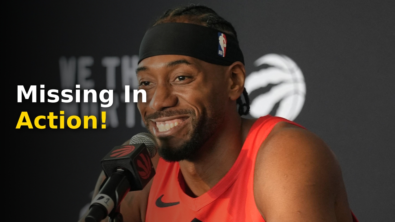 Kawhi Leonard Raptors star wearing team warmup gear on the sidelines