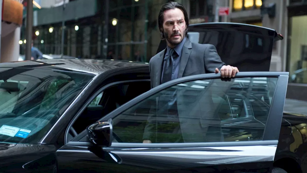 Keanu Reeves as John Wick in the official John Wick Universe Expansion promotional material