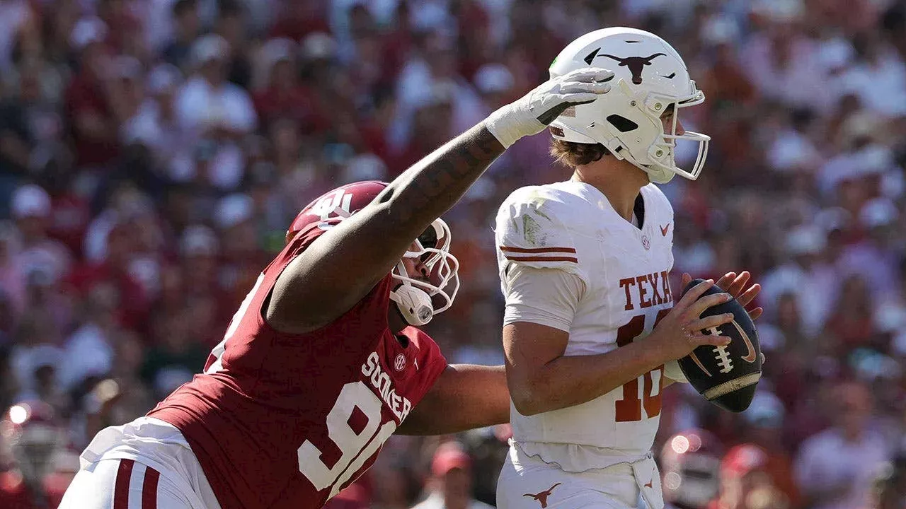 Oklahoma vs Texas 2026 Sooners players storming Cotton Bowl field after walk-off win