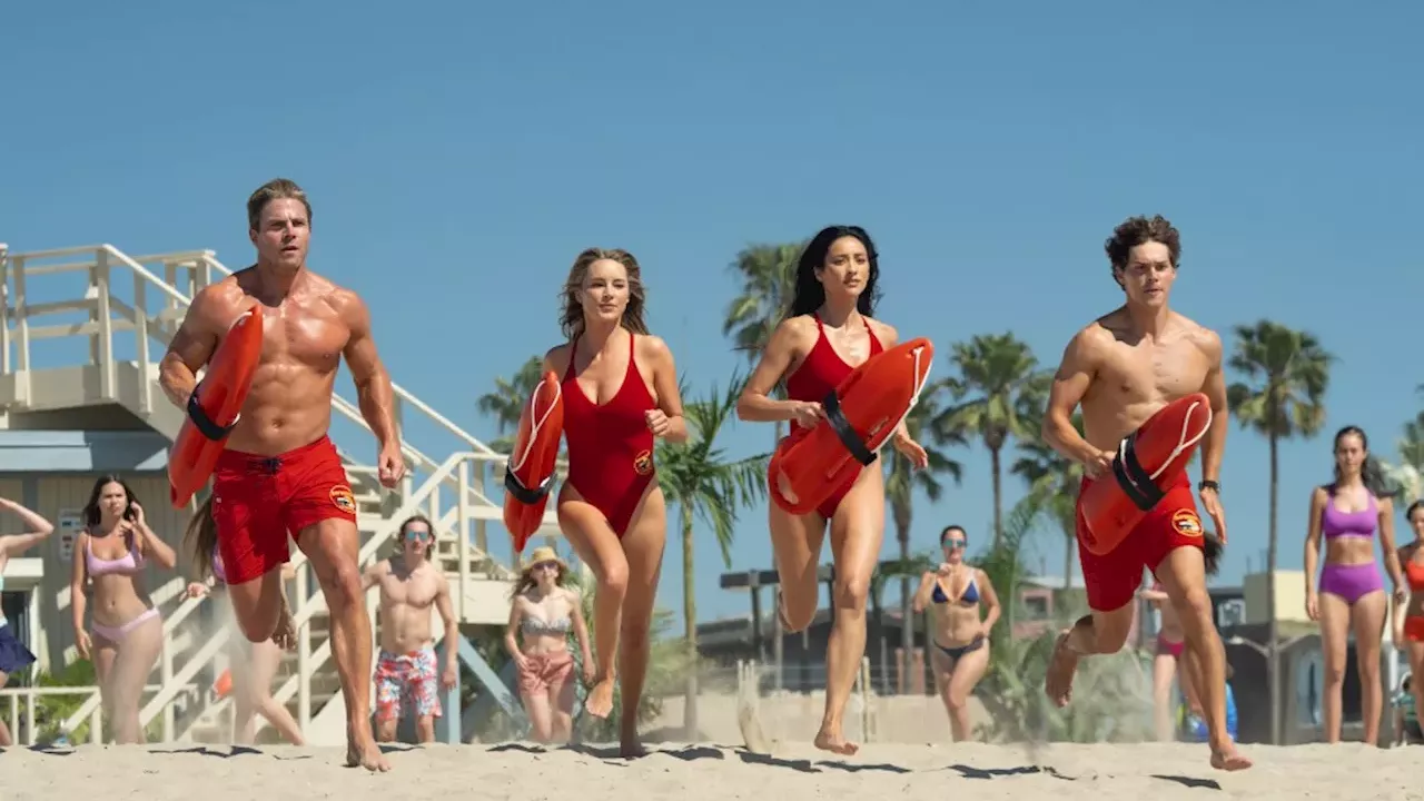 The official baywatch reboot cast lineup featuring Stephen Amell and Noah Beck in red trunks